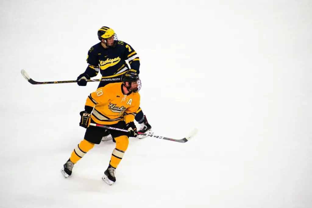 Hockey Players Playing Inside a Rink