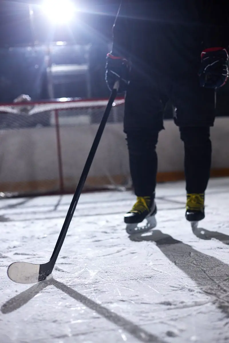 Ice Hockey Player Holding a Hockey Stick